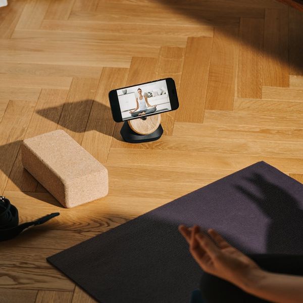Minimalist yoga blocks and equipment on a dark floor