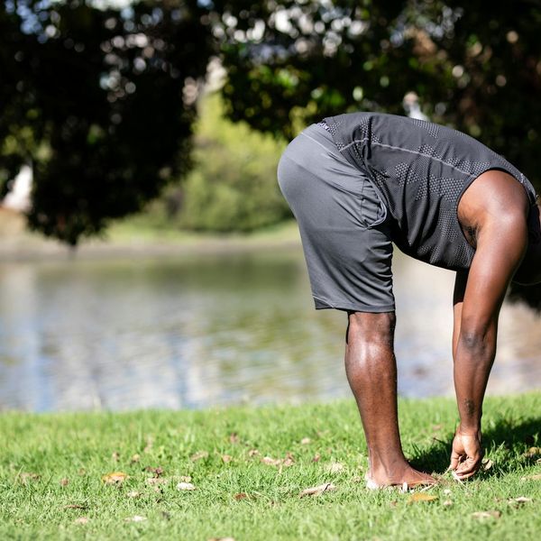 Side view of a person performing a stretching exercise